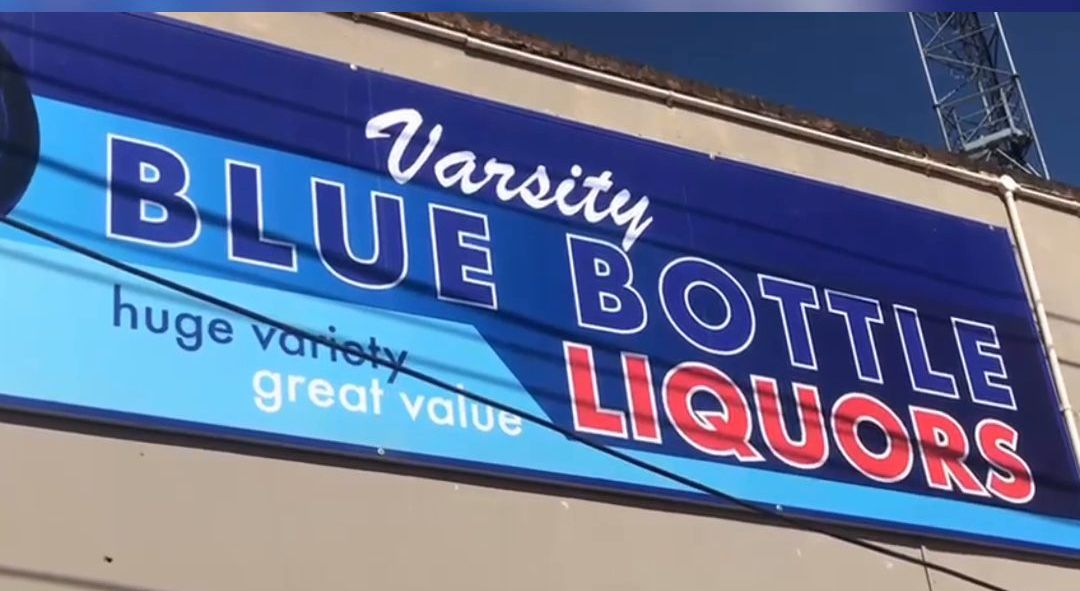 Varsity Blue Bottle Liquors shop sign
