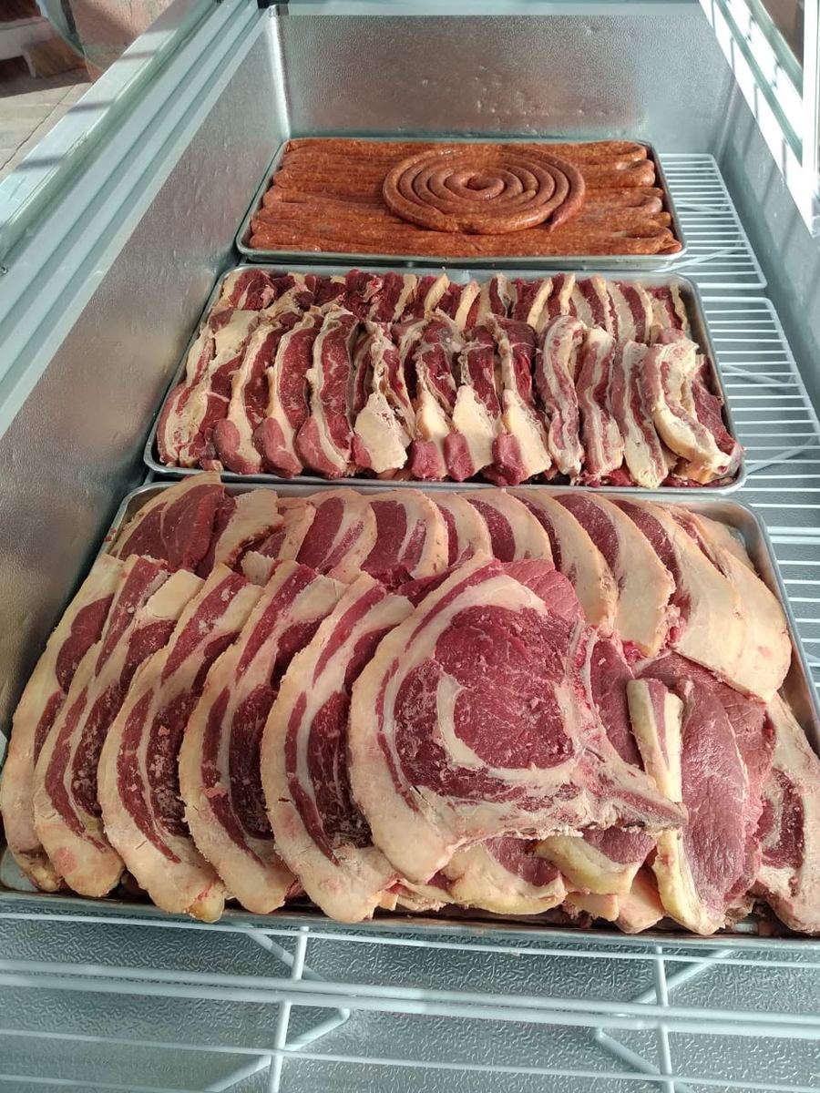 Chiller display at Varsity Butchery with trays of brisket, chops and sausage